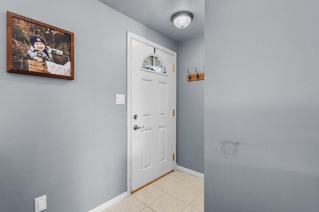 doorway featuring light tile patterned flooring