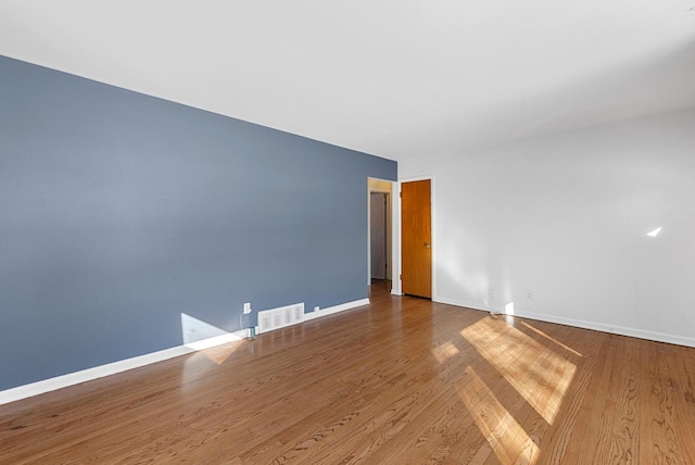 empty room featuring hardwood / wood-style floors