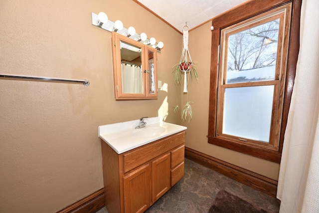 bathroom featuring vanity and crown molding