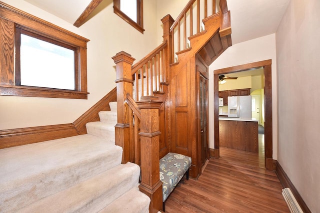 stairs with hardwood / wood-style flooring