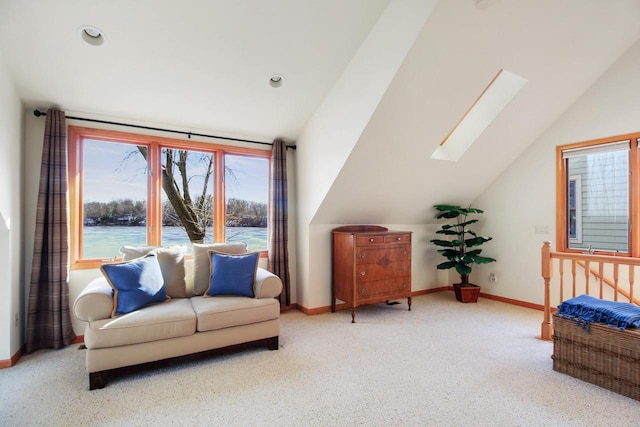 W5553 Oak Park Rd, Elkhorn, WI 53121 - sitting room with a water view, lofted ceiling with skylight, and light colored carpet