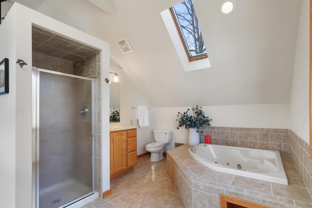 W5553 Oak Park Rd, Elkhorn, WI 53121 - full bathroom featuring vanity, plus walk in shower, vaulted ceiling with skylight, tile patterned flooring, and toilet