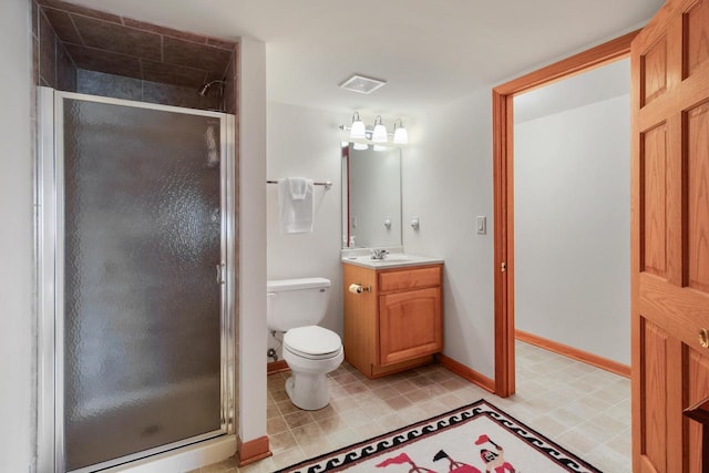 W5553 Oak Park Rd, Elkhorn, WI 53121 - bathroom featuring toilet, vanity, and a shower with shower door