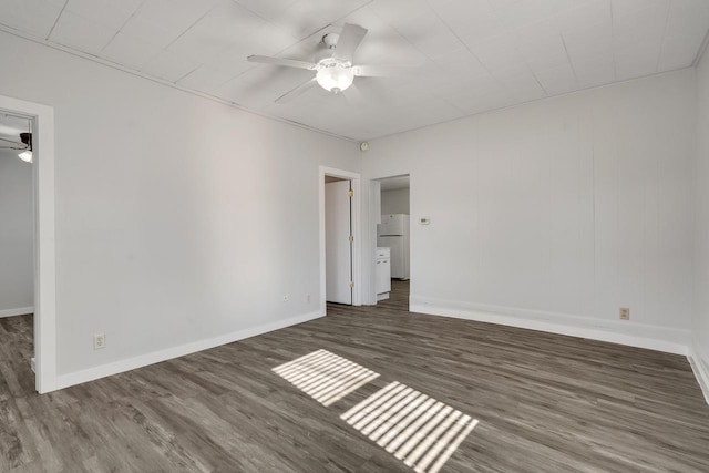 unfurnished room with ceiling fan and dark hardwood / wood-style floors