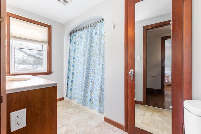 bathroom with toilet and vanity