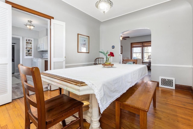 dining room featuring light hardwood / wood-style flooring and ceiling fan