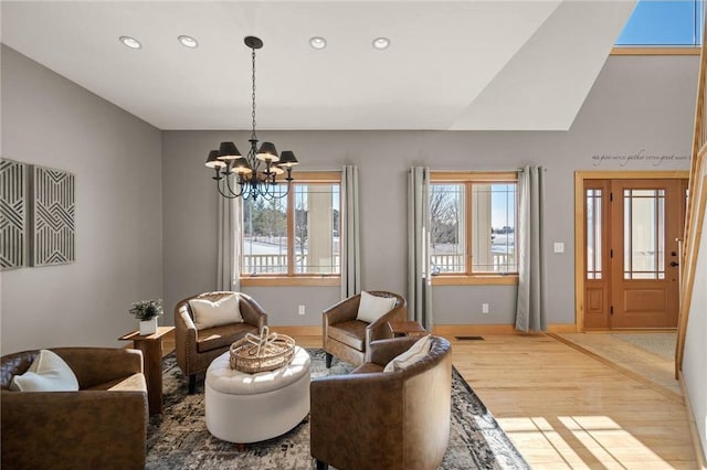 living room featuring a chandelier and hardwood / wood-style floors