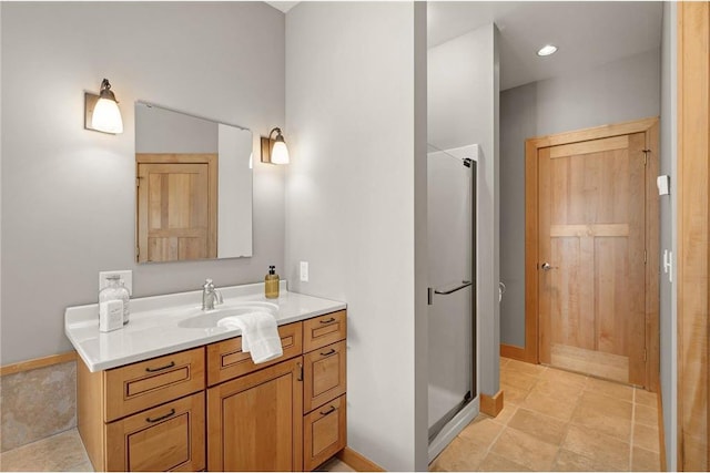 bathroom with vanity and an enclosed shower