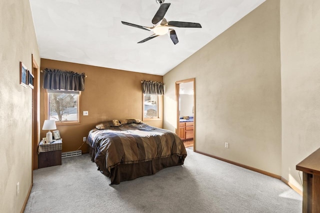 carpeted bedroom featuring ceiling fan, vaulted ceiling, and connected bathroom