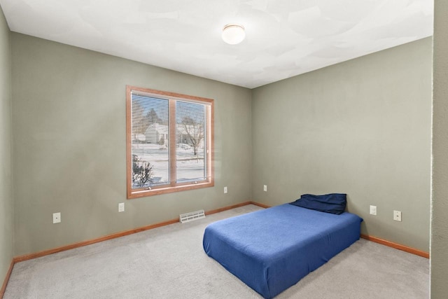 bedroom with light carpet