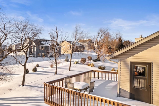 view of snow covered deck