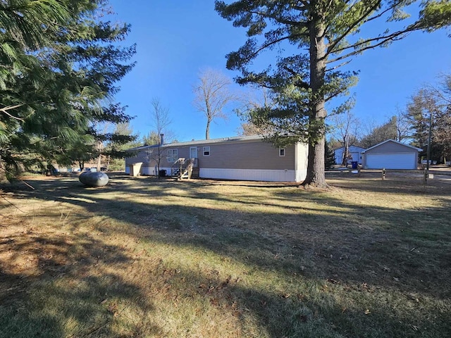 back of house featuring a yard