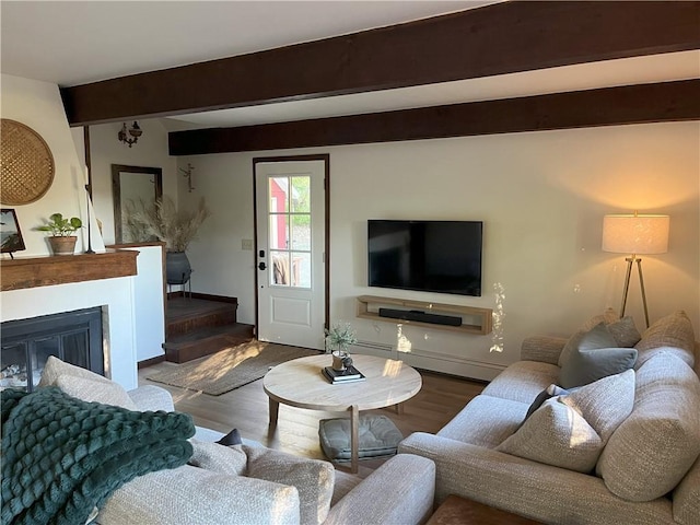 living room with hardwood / wood-style flooring and beamed ceiling