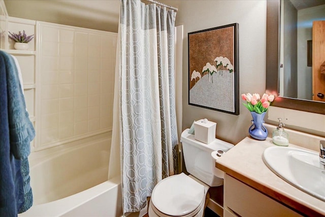 full bathroom featuring toilet, shower / tub combo with curtain, and vanity