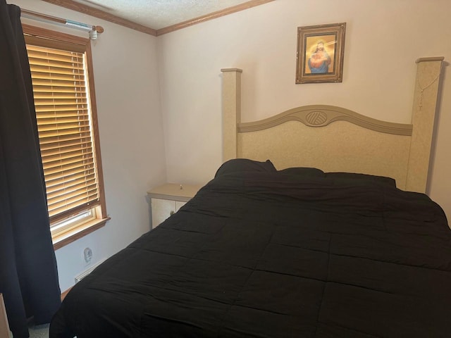 bedroom with ornamental molding