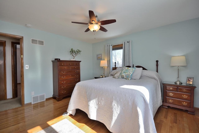 bedroom featuring hardwood / wood-style flooring and ceiling fan