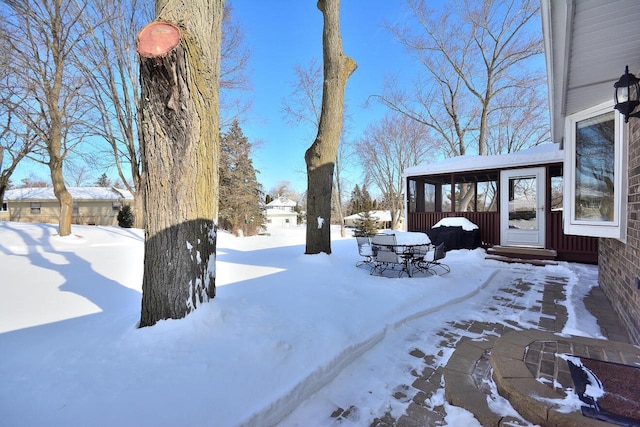 view of yard covered in snow