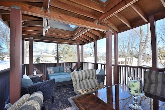 sunroom / solarium with vaulted ceiling