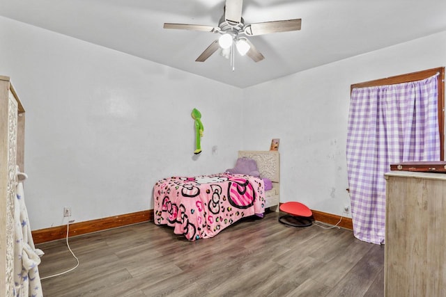 bedroom featuring ceiling fan and wood-type flooring