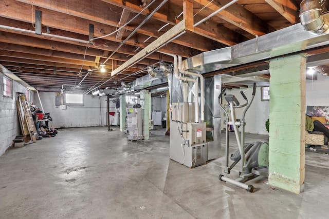 basement featuring heating unit, water heater, and electric panel