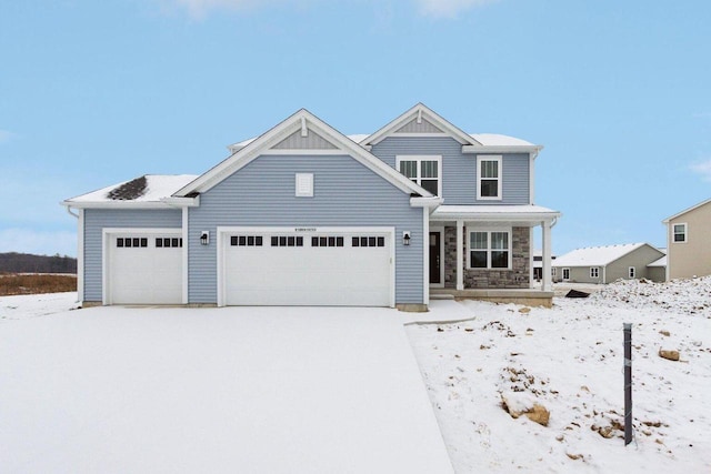 view of front of home with a garage and a porch