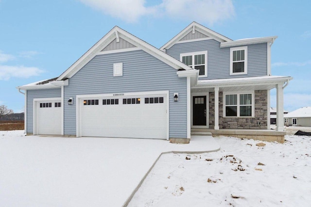 craftsman-style home featuring a garage and covered porch