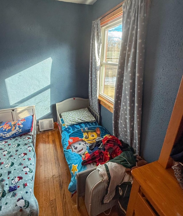 bedroom featuring hardwood / wood-style flooring