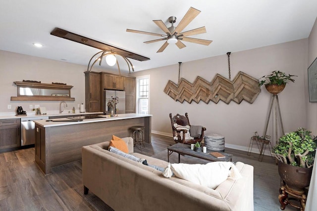 living room with ceiling fan, sink, and dark hardwood / wood-style flooring