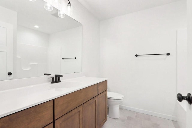 bathroom with vanity and toilet