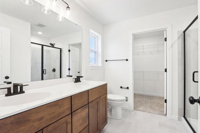 bathroom with vanity, toilet, and walk in shower