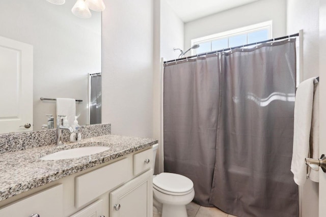 bathroom with shower / bath combination with curtain, vanity, toilet, and tile patterned floors