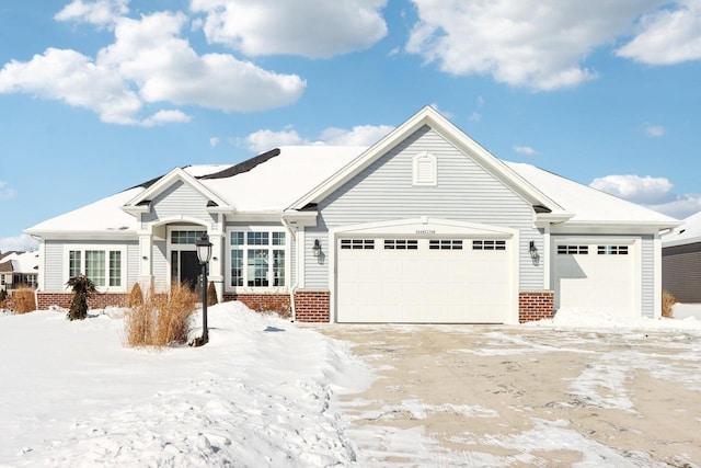 ranch-style house with a garage and brick siding