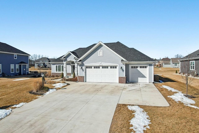 view of front facade featuring brick siding, a residential view, concrete driveway, and a front yard