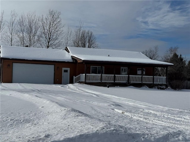 view of front of home featuring a garage and a porch