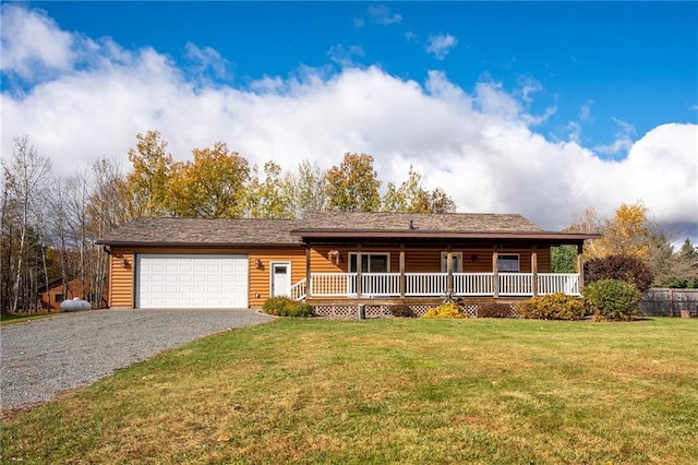 ranch-style house with a garage, covered porch, and a front yard