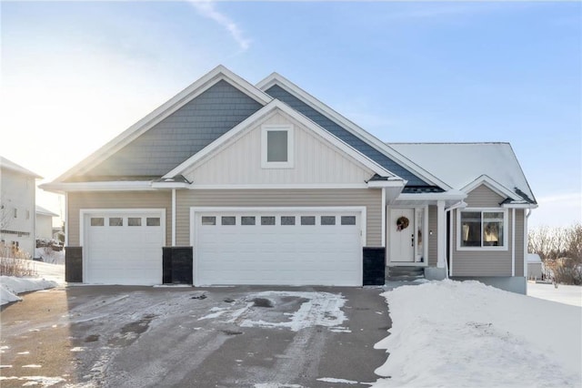 view of front facade with a garage, driveway, and board and batten siding