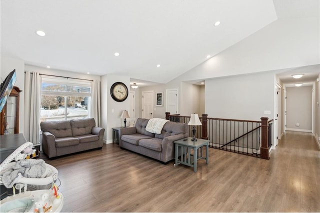 living area featuring recessed lighting, baseboards, and wood finished floors