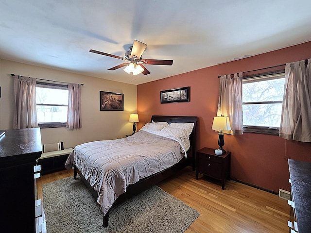 bedroom featuring ceiling fan and light hardwood / wood-style flooring