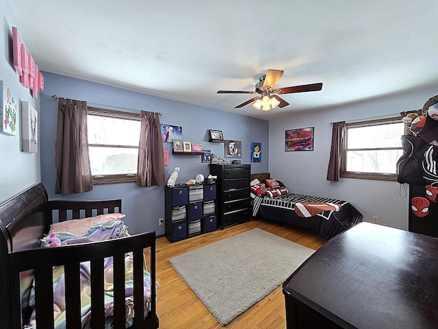 bedroom featuring ceiling fan and light wood-type flooring