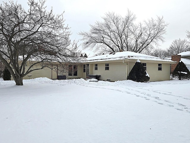 view of snow covered house