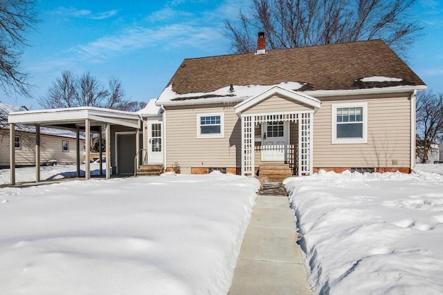 view of snow covered house