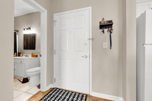 bathroom with tile patterned floors, toilet, and vanity