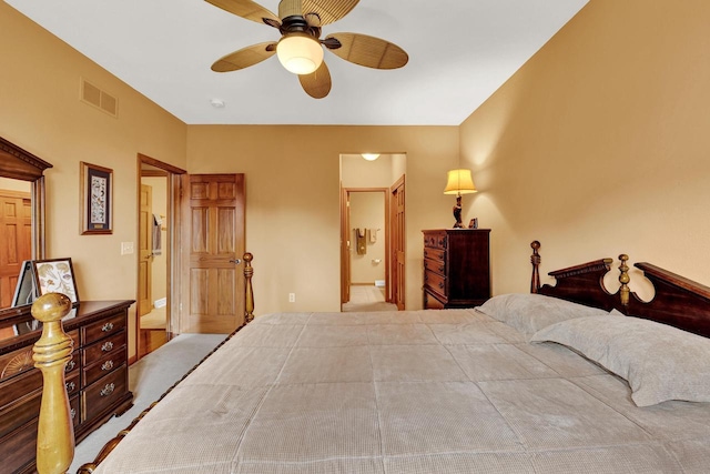 bedroom featuring ceiling fan and ensuite bath