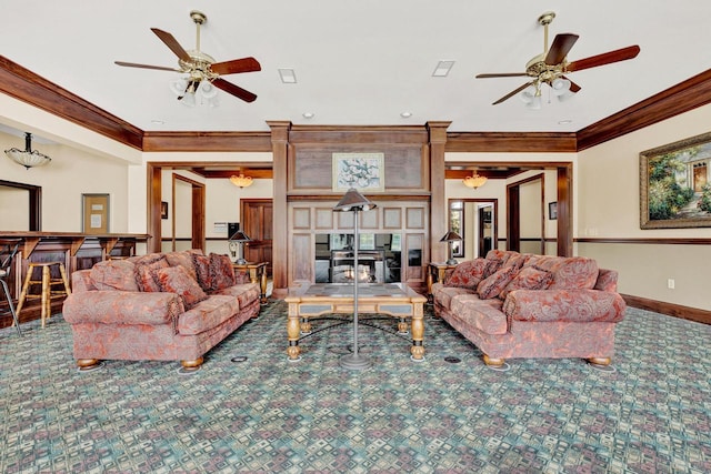 carpeted living room with ceiling fan and ornamental molding