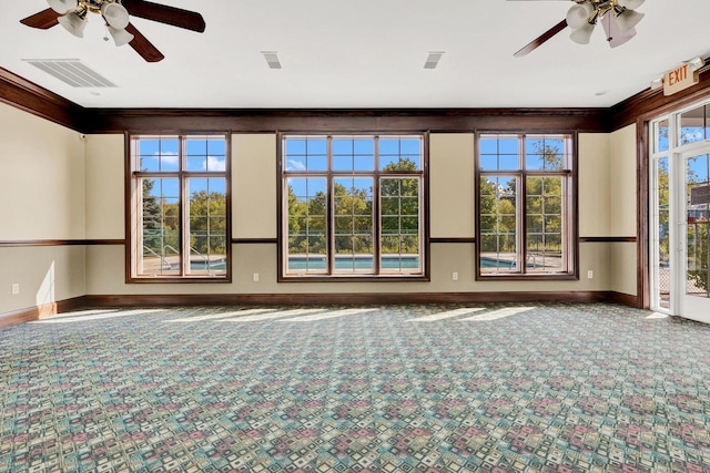 unfurnished room with ceiling fan