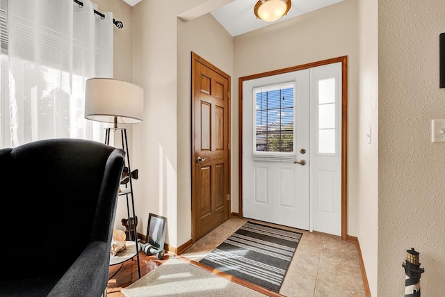 foyer entrance featuring light tile patterned flooring