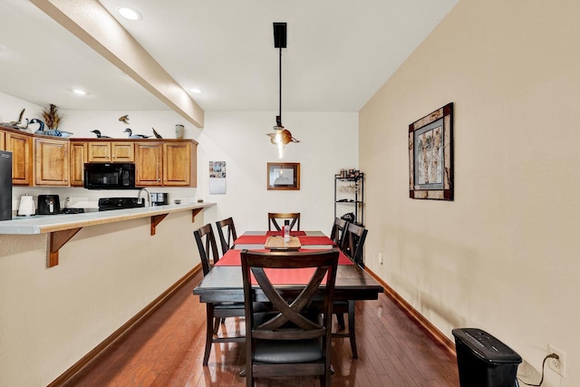 dining area with dark wood-type flooring