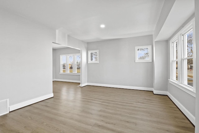 unfurnished room featuring light hardwood / wood-style floors