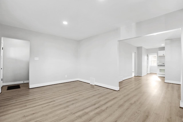 unfurnished living room featuring light hardwood / wood-style floors