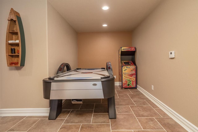 game room with baseboards, dark tile patterned flooring, and recessed lighting